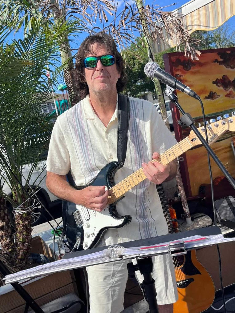 Rich performing with The Alright Guys